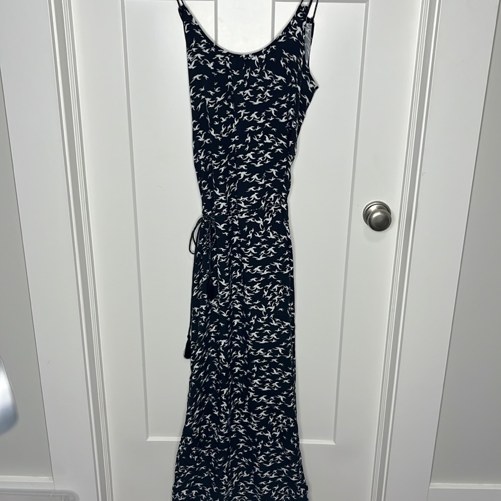Beautiful black boho maxi dress with white nerds and comes with a belt